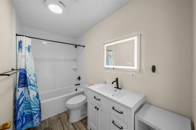 full bathroom with toilet, vanity, hardwood / wood-style flooring, and shower / tub combo with curtain