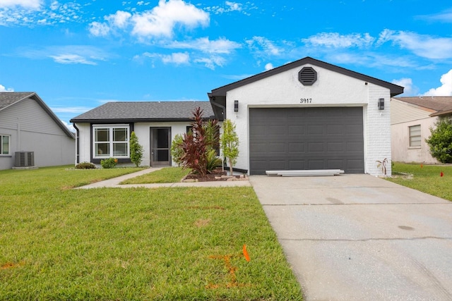 single story home with a garage, a front lawn, and central air condition unit