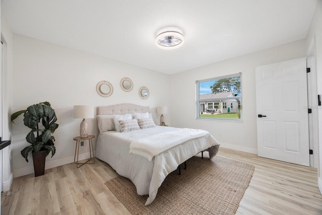 bedroom with light hardwood / wood-style floors