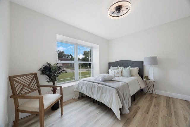 bedroom with light hardwood / wood-style flooring