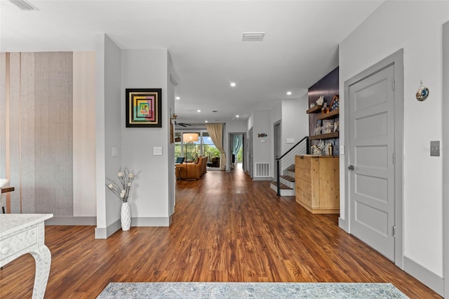 hallway with dark hardwood / wood-style floors