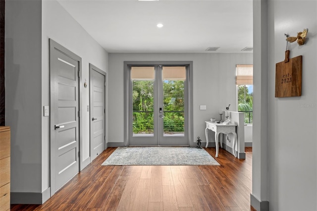 doorway featuring dark hardwood / wood-style flooring and french doors