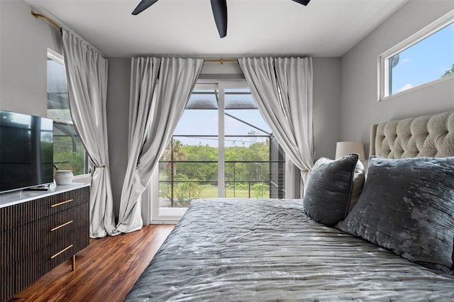 bedroom with wood-type flooring, access to exterior, and ceiling fan