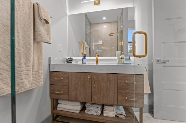 bathroom with vanity and a shower with shower door