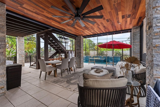 view of patio / terrace featuring ceiling fan