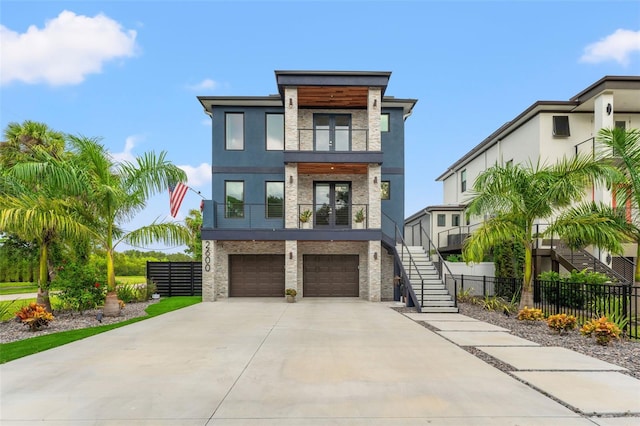 modern home with a garage and a balcony