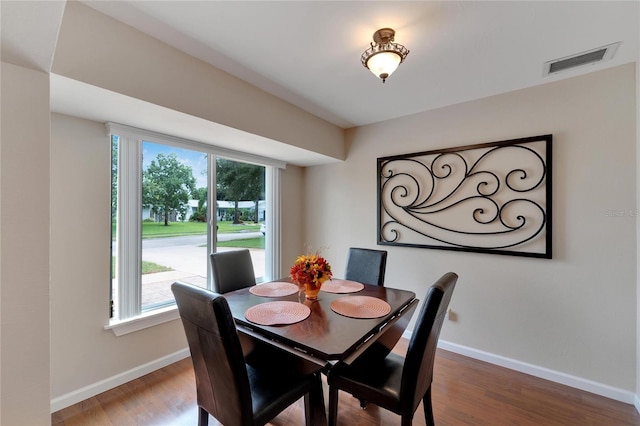 dining space featuring hardwood / wood-style flooring