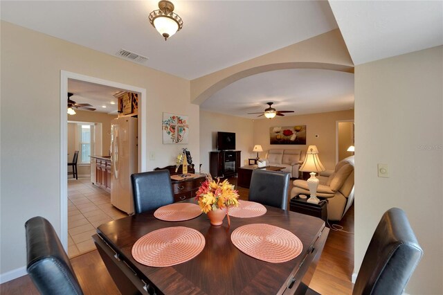 dining area featuring ceiling fan and light wood-type flooring