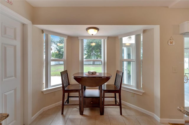 dining area with light tile patterned floors