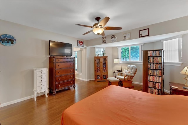 bedroom with hardwood / wood-style floors and ceiling fan