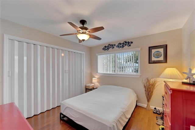 bedroom with light wood-type flooring and ceiling fan