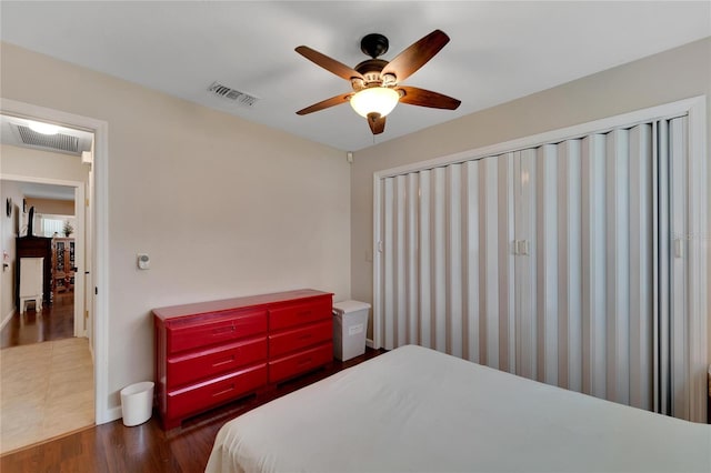 bedroom with ceiling fan and dark hardwood / wood-style floors