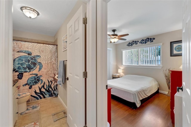 bedroom featuring ceiling fan and wood-type flooring