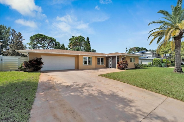 single story home featuring a front yard and a garage