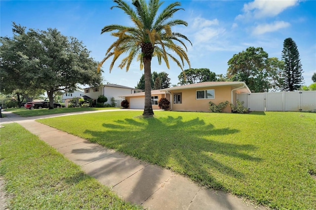 ranch-style house with a front lawn and a garage