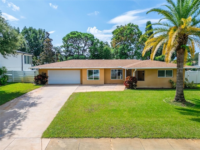 view of front of home featuring a front lawn and a garage