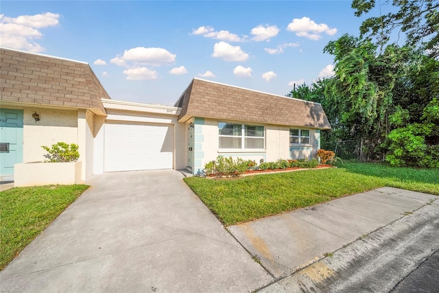 ranch-style house featuring a garage and a front yard