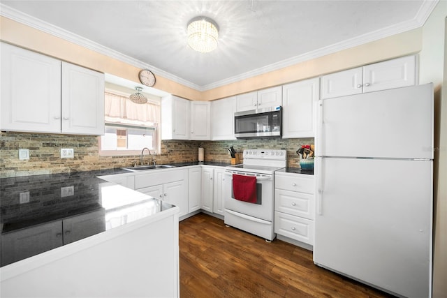 kitchen featuring white appliances, white cabinetry, sink, and dark hardwood / wood-style flooring