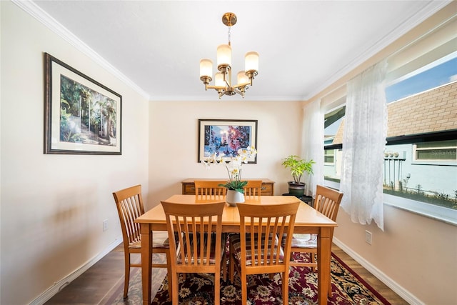 dining area featuring ornamental molding, a chandelier, and dark hardwood / wood-style floors