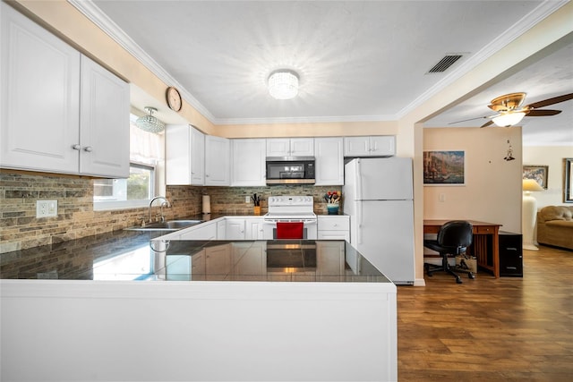 kitchen featuring ceiling fan, white cabinets, sink, white appliances, and dark wood-type flooring