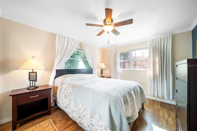 bedroom with ornamental molding, ceiling fan, and hardwood / wood-style floors