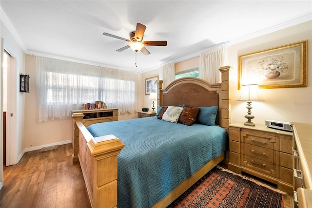 bedroom with multiple windows, crown molding, dark hardwood / wood-style floors, and ceiling fan