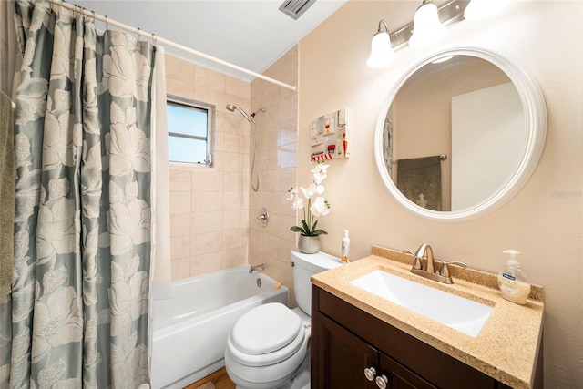 full bathroom with shower / bath combo, vanity, and toilet