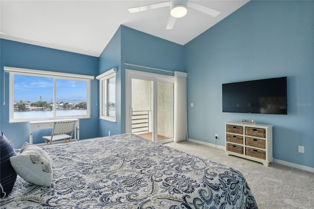 bedroom with lofted ceiling, a water view, ceiling fan, and light colored carpet