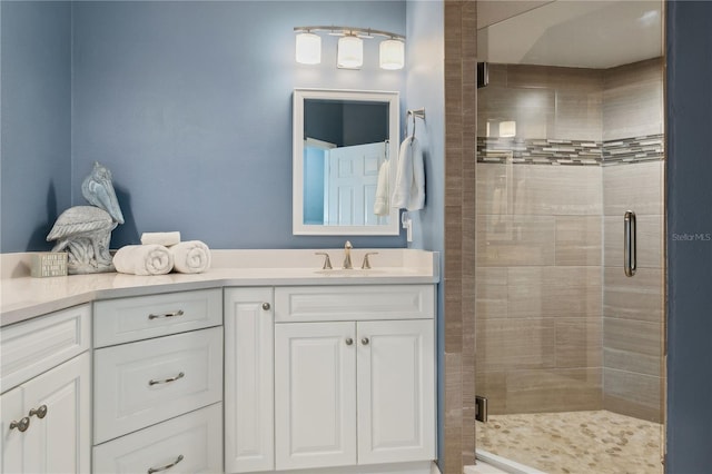 bathroom with vanity and an enclosed shower