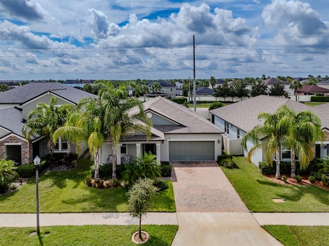 single story home with a garage and a front yard