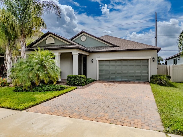 view of front of house featuring a garage and a front yard