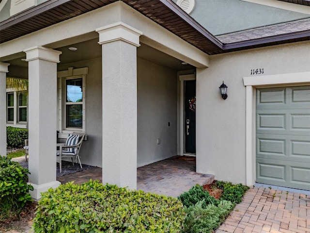 property entrance with a garage