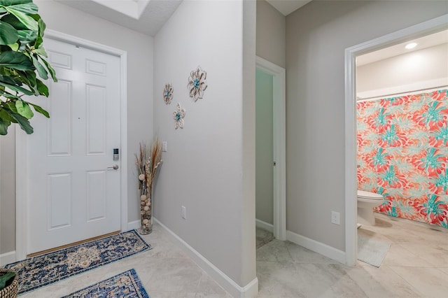 foyer entrance featuring a textured ceiling