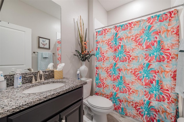 bathroom featuring tile patterned floors, walk in shower, toilet, and vanity