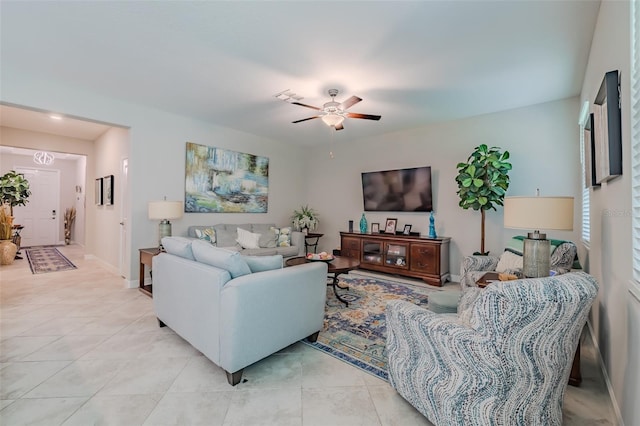 tiled living room featuring ceiling fan