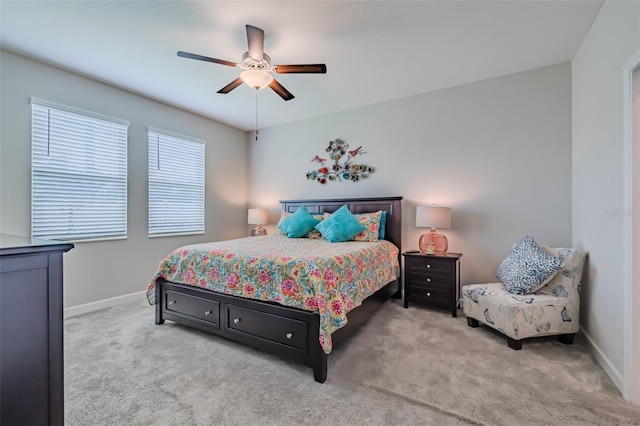 bedroom with light carpet and ceiling fan