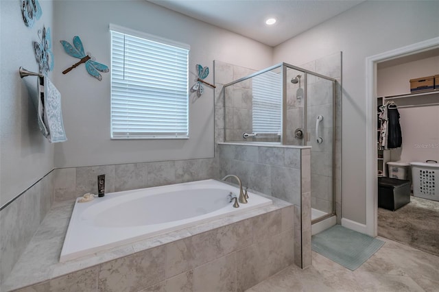 bathroom featuring independent shower and bath and tile patterned floors