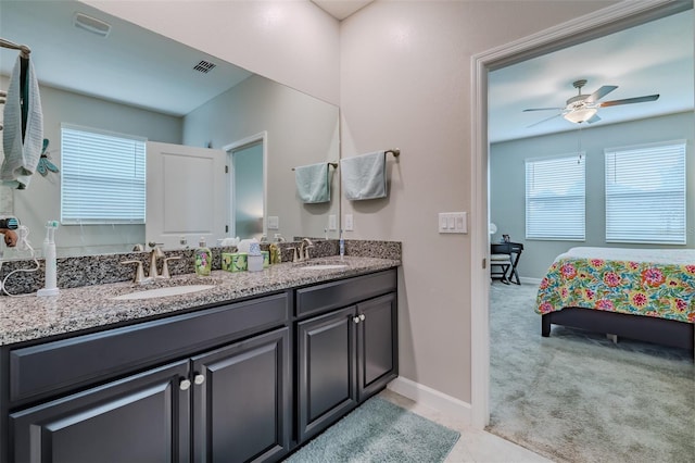 bathroom featuring ceiling fan and vanity