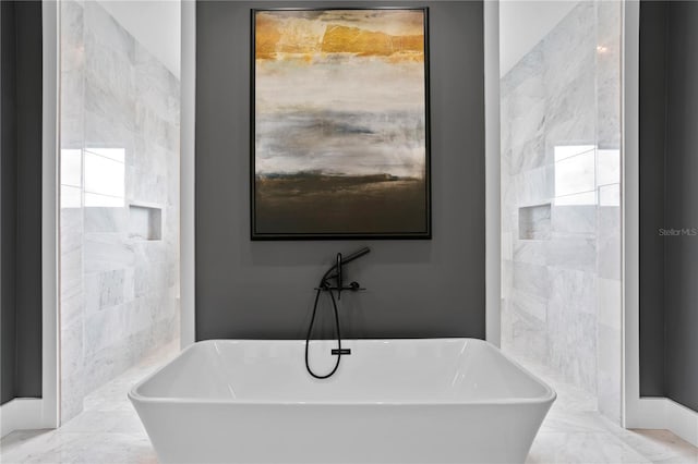 bathroom featuring a tub to relax in