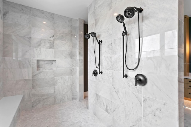 bathroom with a tile shower