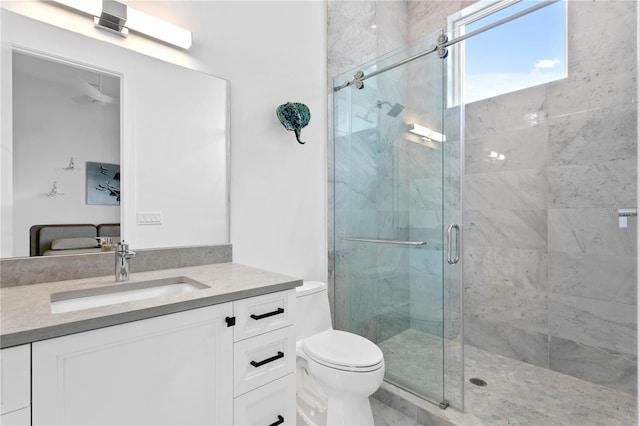 bathroom with vanity, toilet, and walk in shower