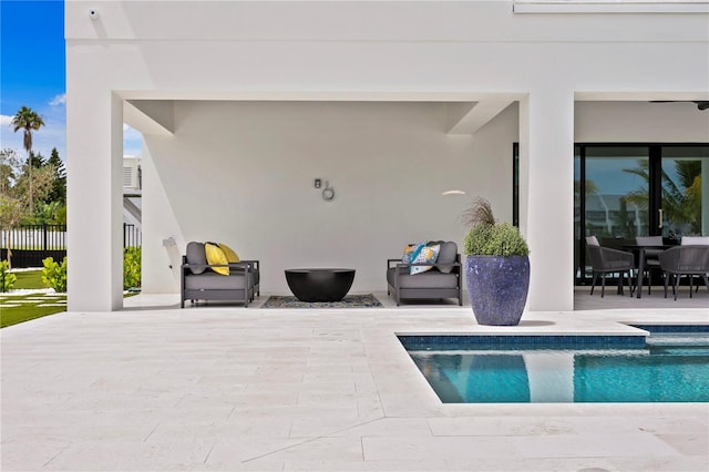 view of swimming pool featuring a patio area