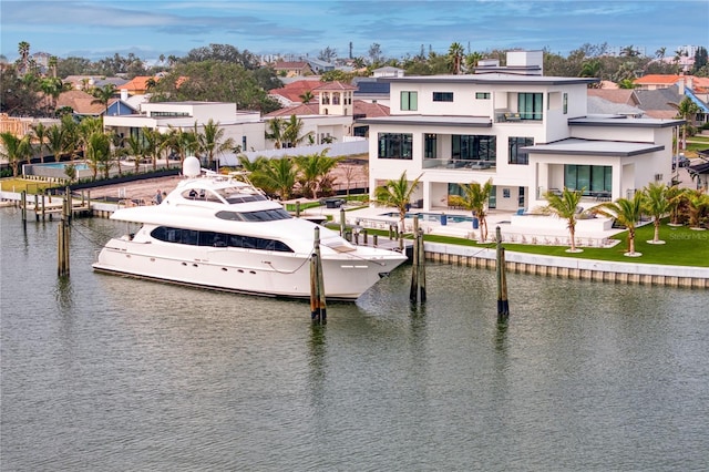 exterior space featuring a balcony and a water view