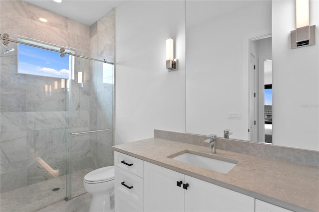 bathroom with vanity, toilet, and an enclosed shower