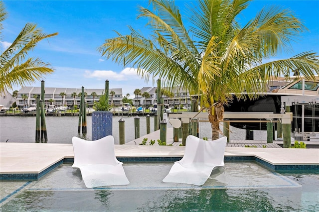 view of dock featuring a patio area and a water view