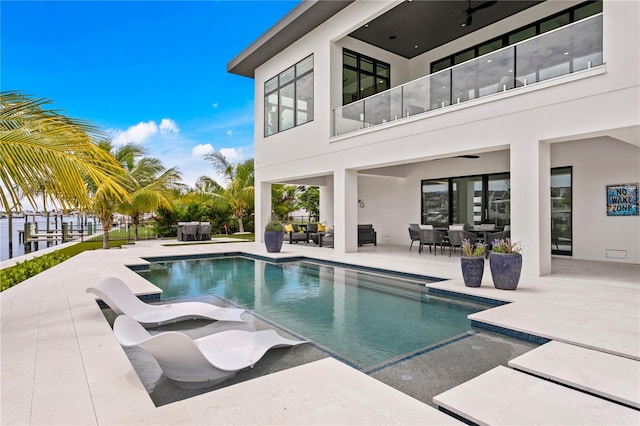 view of swimming pool featuring an outdoor hangout area and a patio