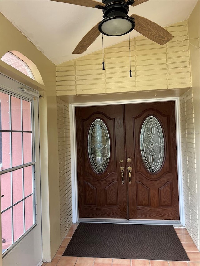 entrance to property featuring ceiling fan