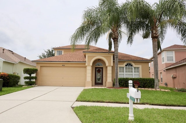 mediterranean / spanish house featuring a garage and a front lawn