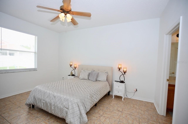 bedroom with light tile patterned floors and ceiling fan