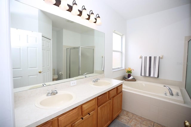 full bathroom with shower with separate bathtub, tile patterned floors, vanity, and toilet